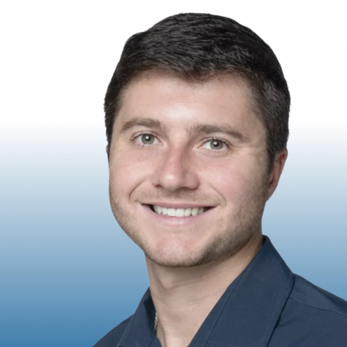 Dark-haired man in a navy shirt, Equity team member headshot